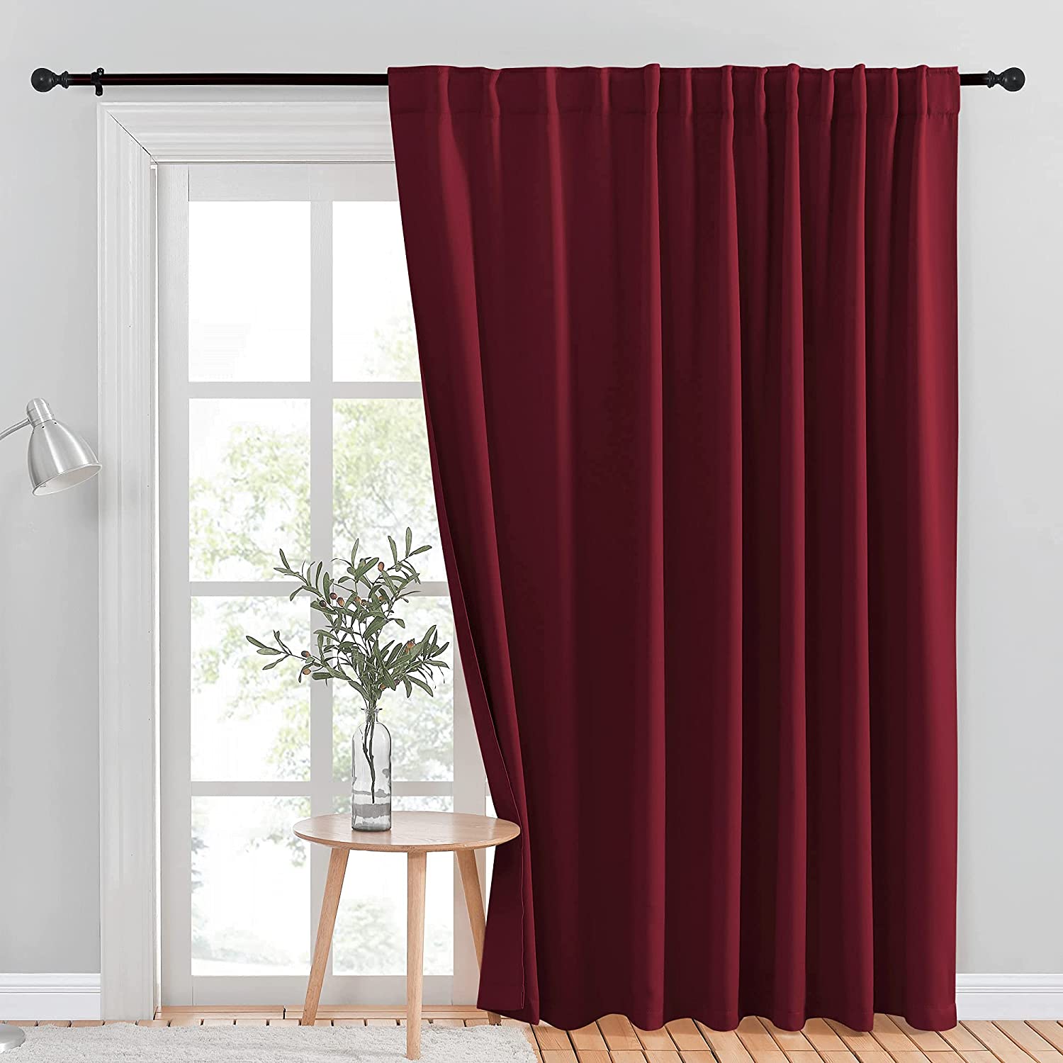 Single deep red blackout curtain panel, rod pocket & back tab, offers room darkening and privacy protection.