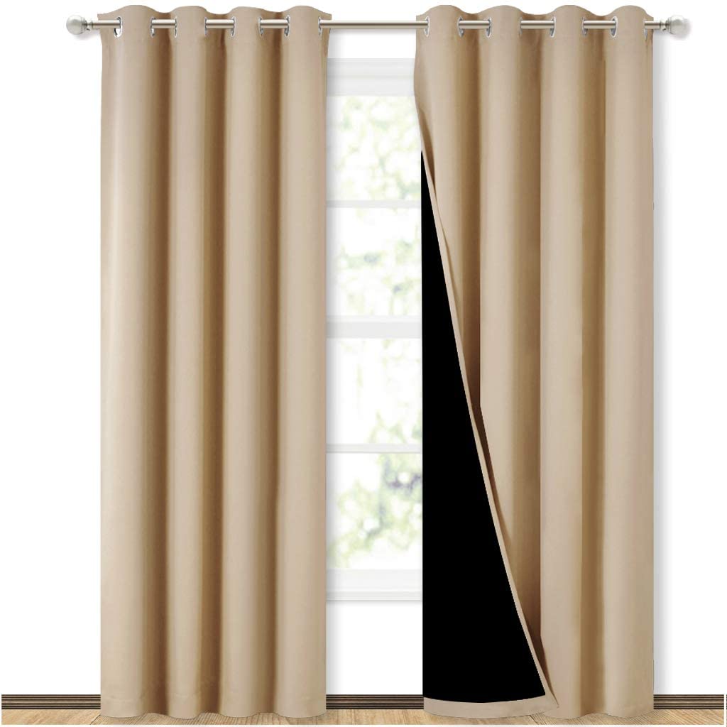Two beige double layer grommet blackout curtains (2 panels) for a sliding glass door, one pulled back to reveal black lining.