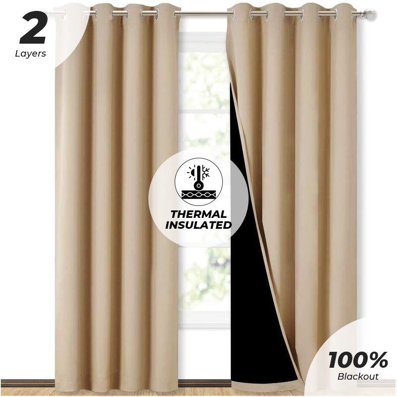 Two panels of tan double layer blackout curtains with silver grommets, revealing thermal insulation for sliding glass doors.