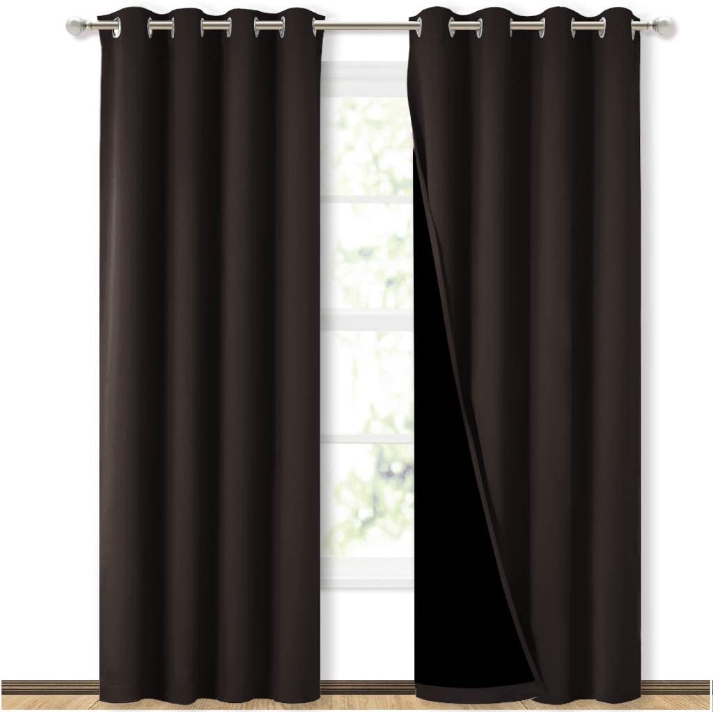 Brown double layer grommet blackout curtains for sliding glass door. Two panels on a rod, one revealing the black inner layer.