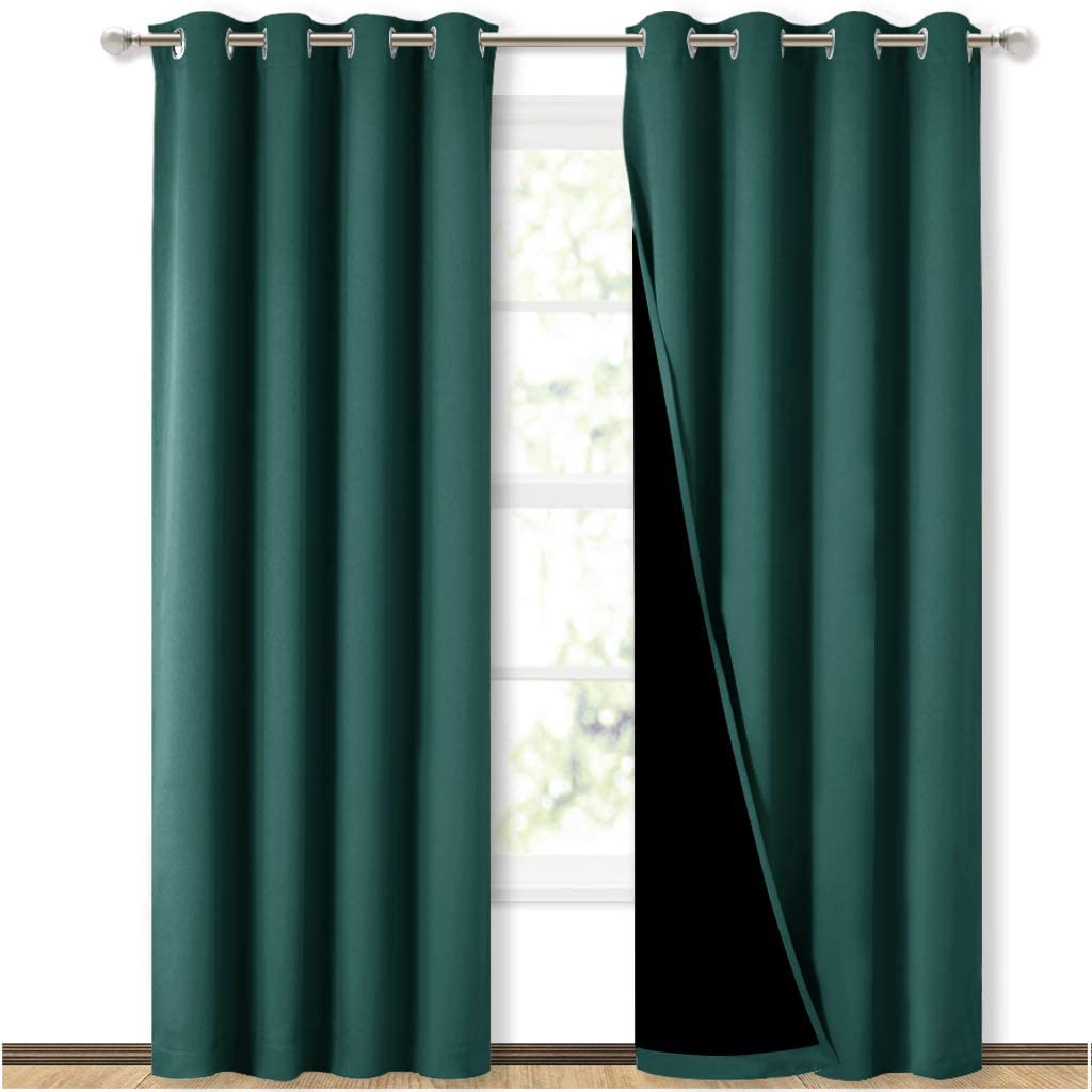 Dark green double layer grommet blackout curtains for living room or bedroom, revealing black noise reducing lining.