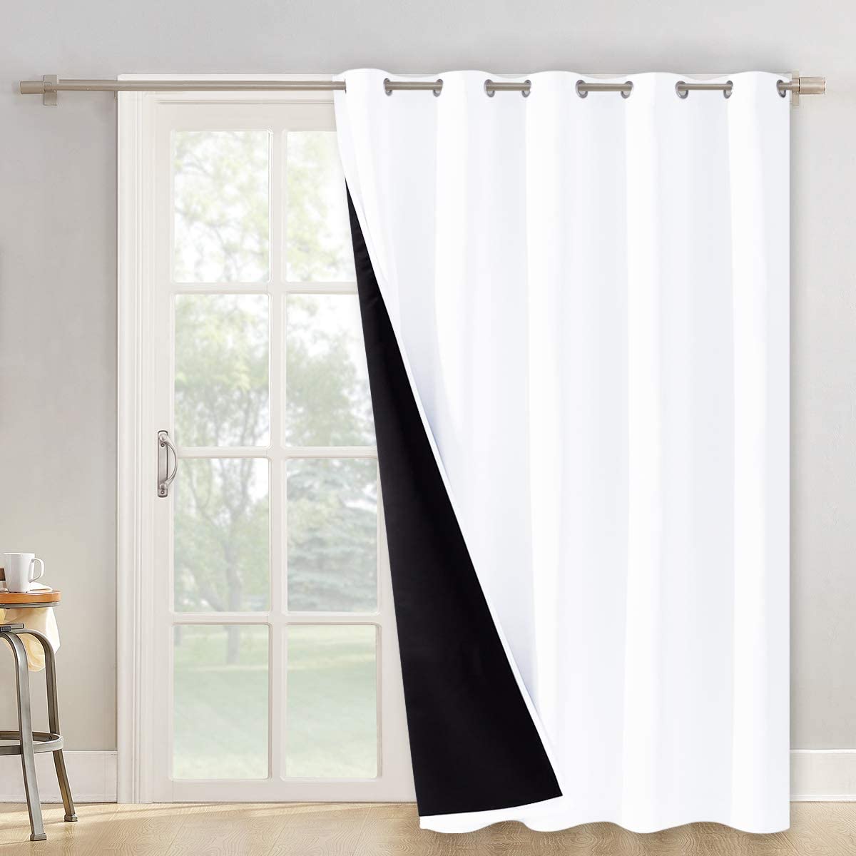 White double layer grommet blackout curtain panel for living room or bedroom, revealing its black noise reducing layer.