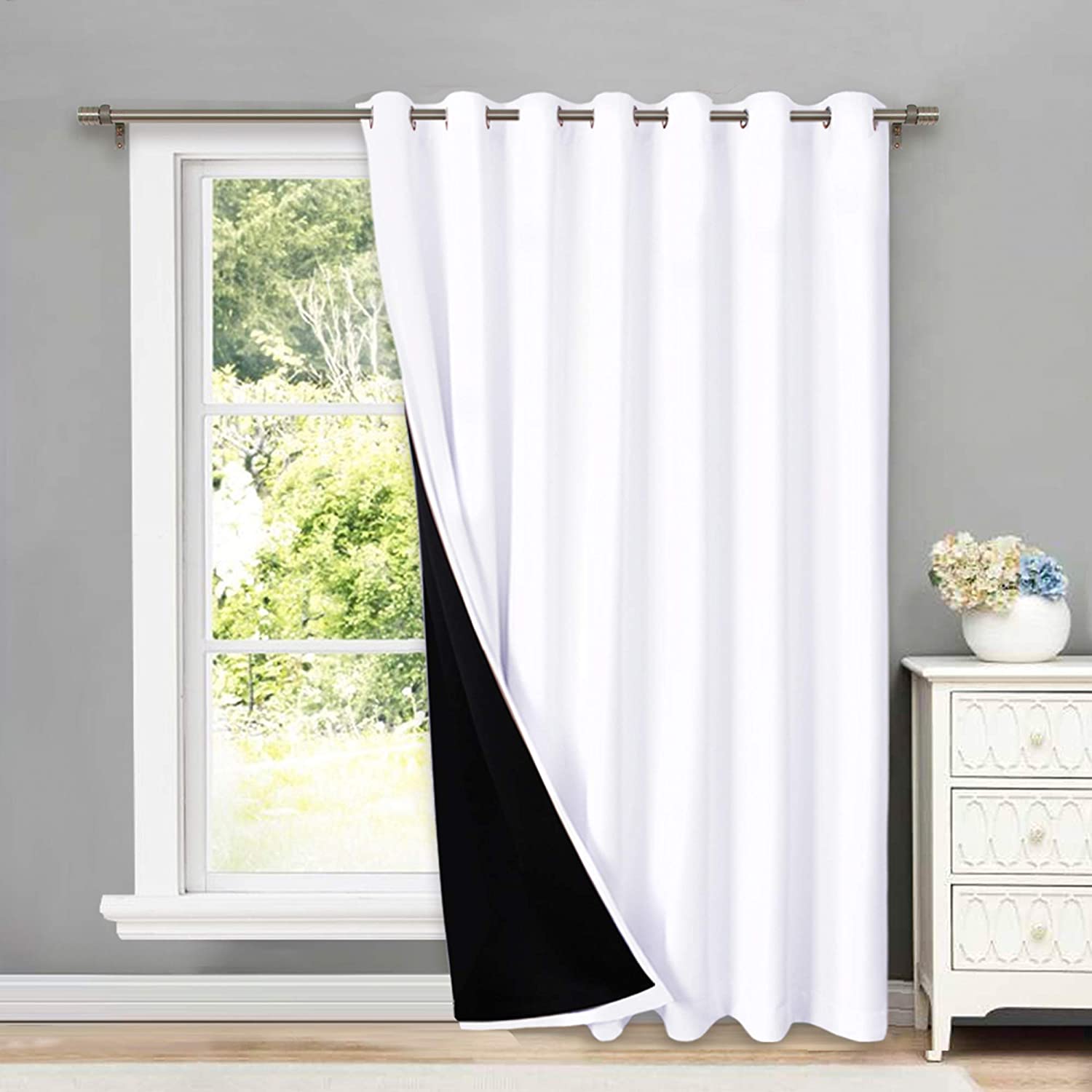 White double layer grommet thermal insulated blackout curtain panel with black lining for living room or bedroom windows.