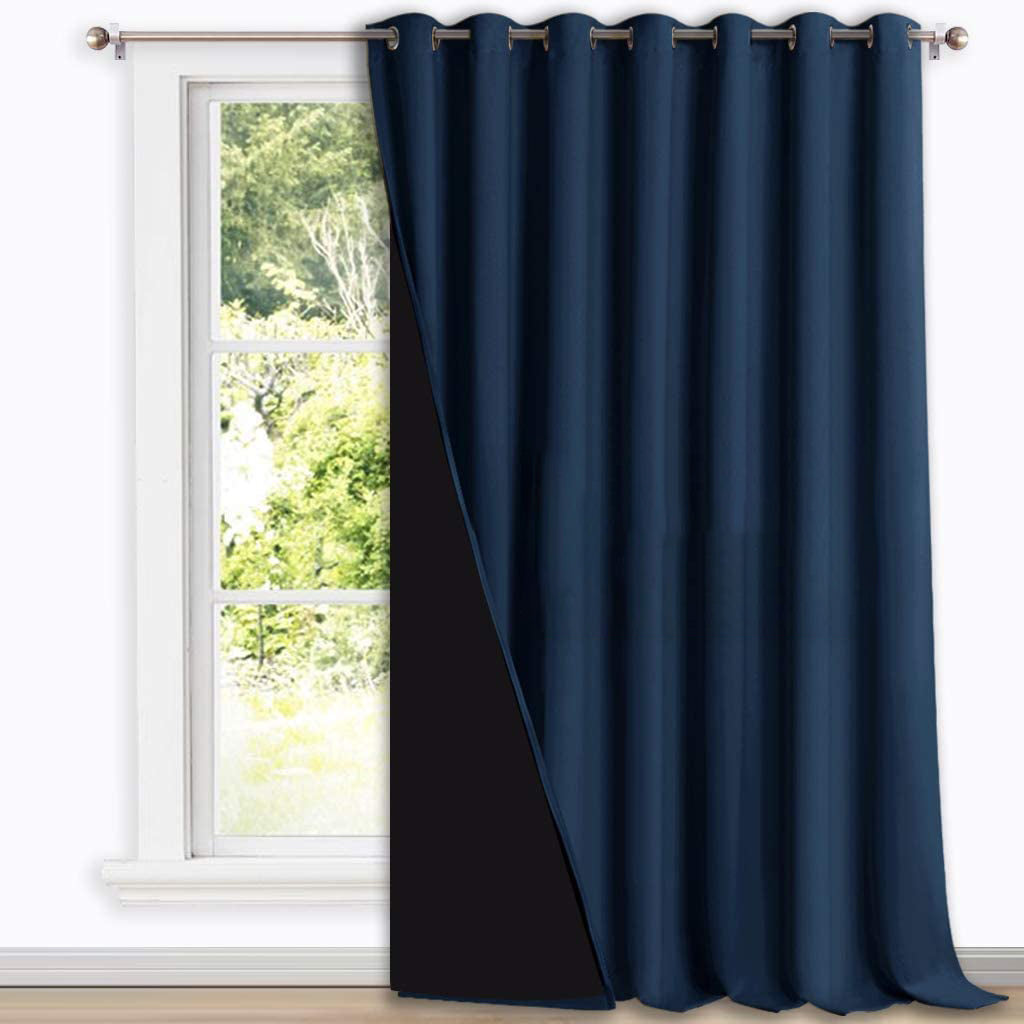 Navy blue double layer grommet blackout curtain panel, revealing its black thermal insulated lining for optimal room darkening.