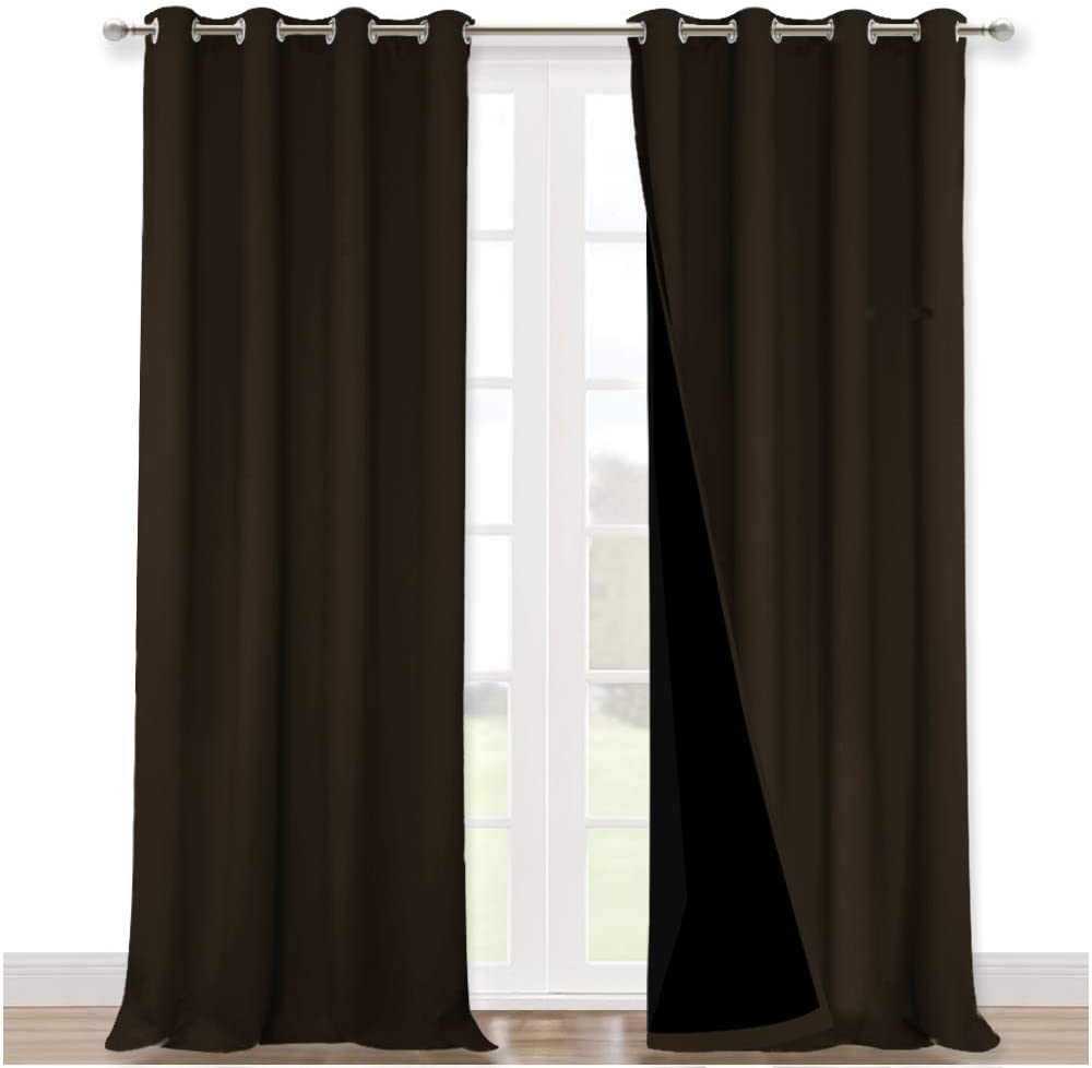 Two panels of dark brown double layer noise reducing living room curtains with silver grommets, one revealing blackout lining.