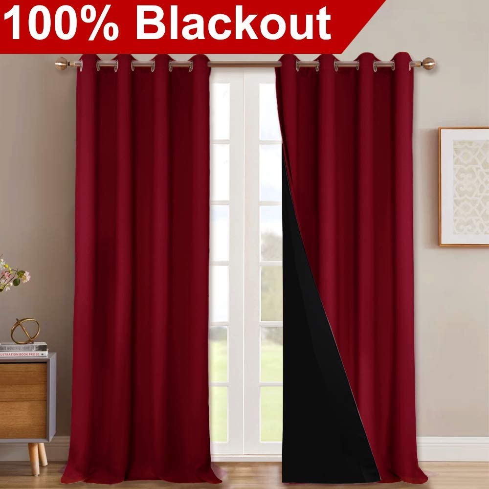 Vivid red double layer blackout curtains with silver grommets for a living room, revealing the black noise-reducing inner lining.