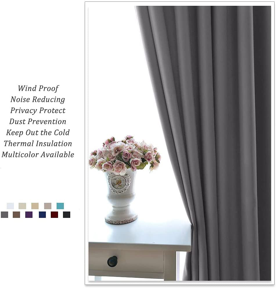 KGORGE dark gray blackout grommet curtain panel beside a window, offering noise reduction, thermal insulation, and privacy for living room.