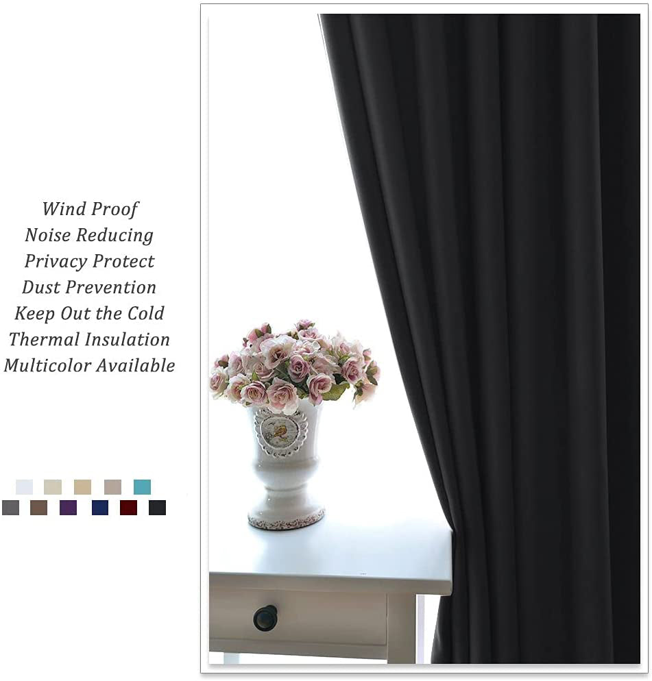 Black noise reducing blackout grommet curtain panel, providing thermal insulation and privacy for a living room or bedroom window.