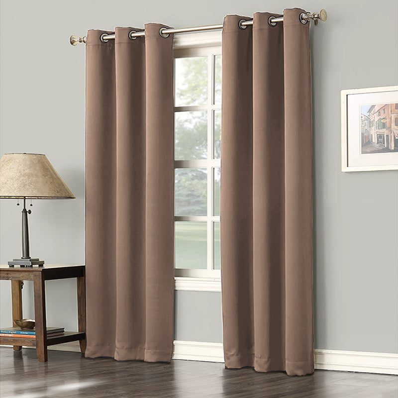 Two brown grommet blackout curtains partially open over a window, ideal for living room or bedroom decor.