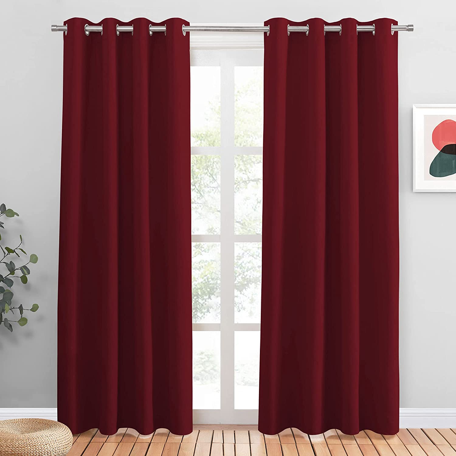 Vibrant maroon grommet blackout curtains, 2 panels, offering noise reduction & light blocking for a stylish bedroom or living room.