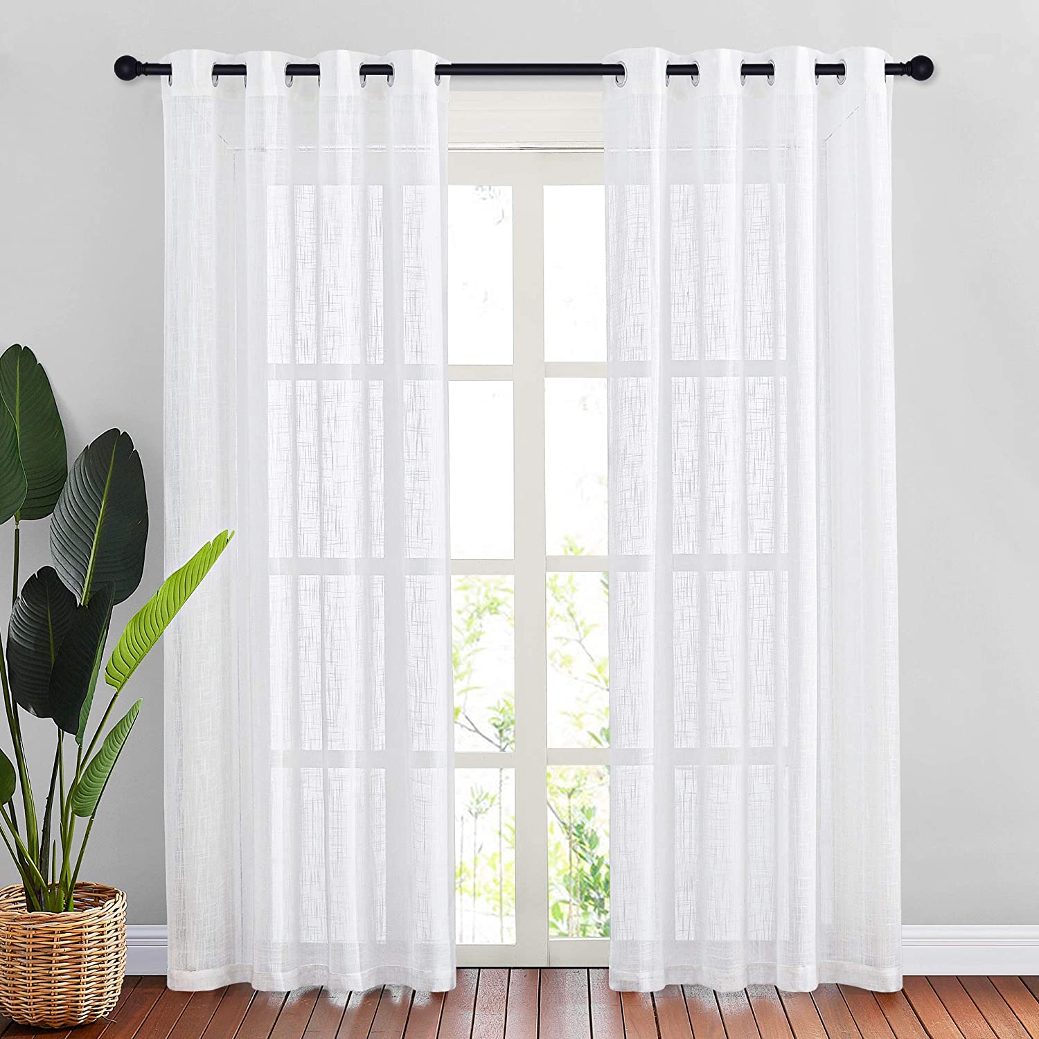White sheer linen-textured grommet curtains, 2 panels, offer privacy for bedroom or living room, filtering natural light.