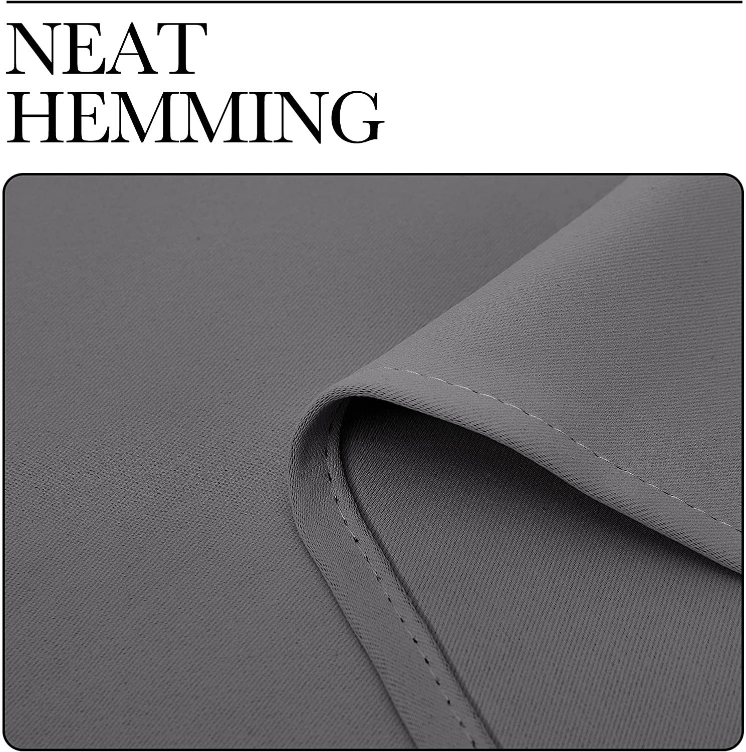 Detailed view of precise white stitching on the durable hem of a grey thermal insulated blackout curtain panel.