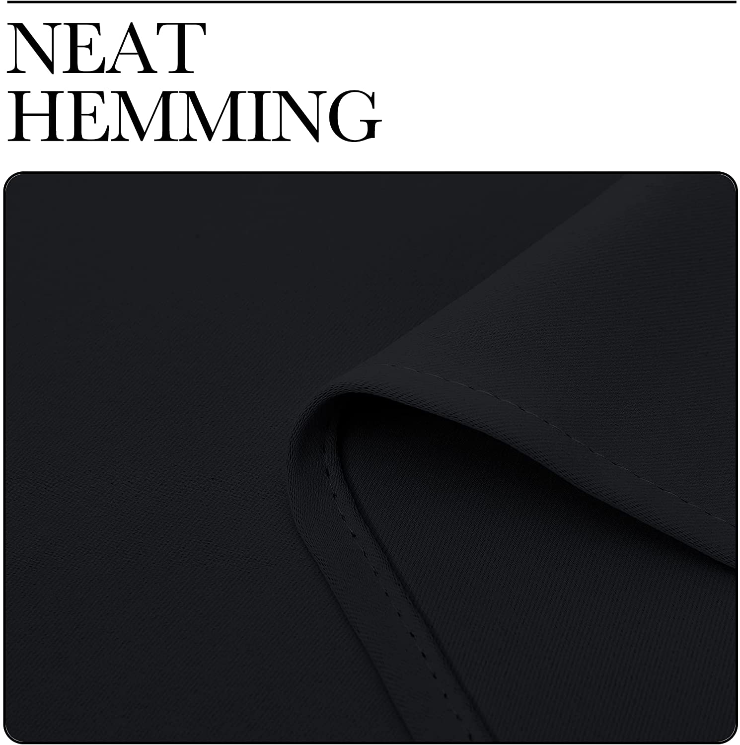 Close-up of neat hemming on a black thermal insulated blackout curtain fabric, emphasizing quality finish for living rooms.