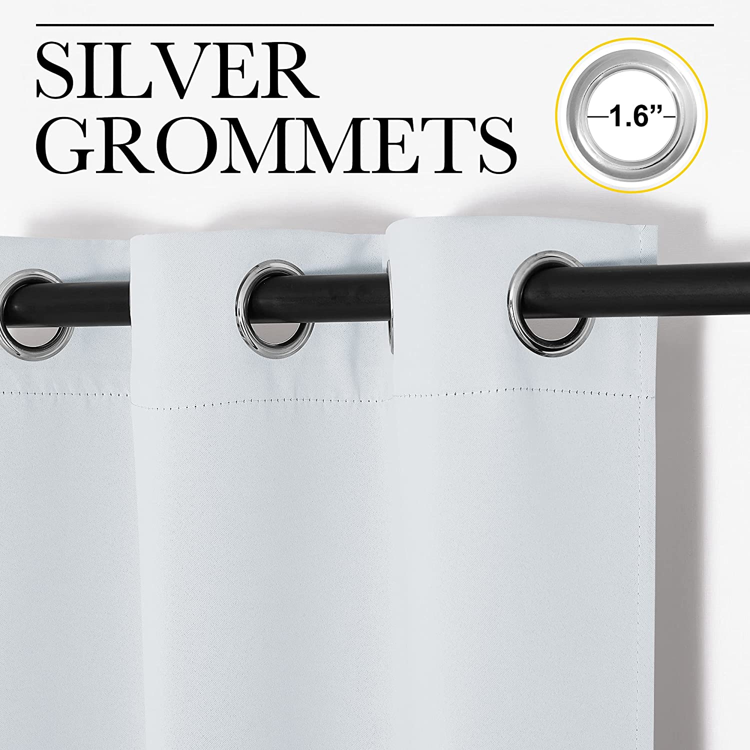 White thermal insulated blackout curtain panels, showcasing 1.6-inch silver grommets on a black rod for living room windows.