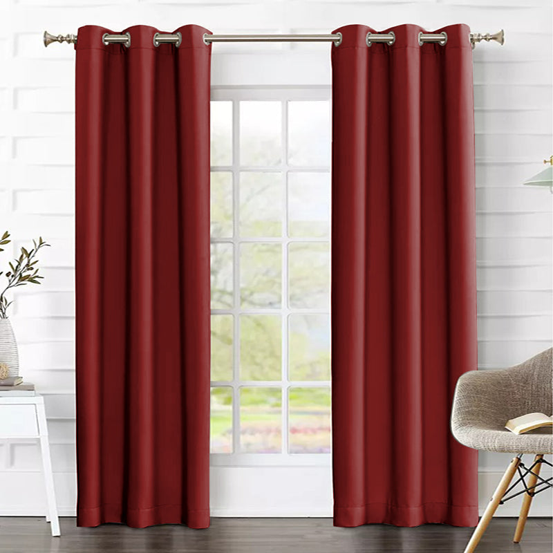 Burgundy thermal insulated blackout curtains with grommets, 2 panels, providing effective light blocking and privacy in a living room.