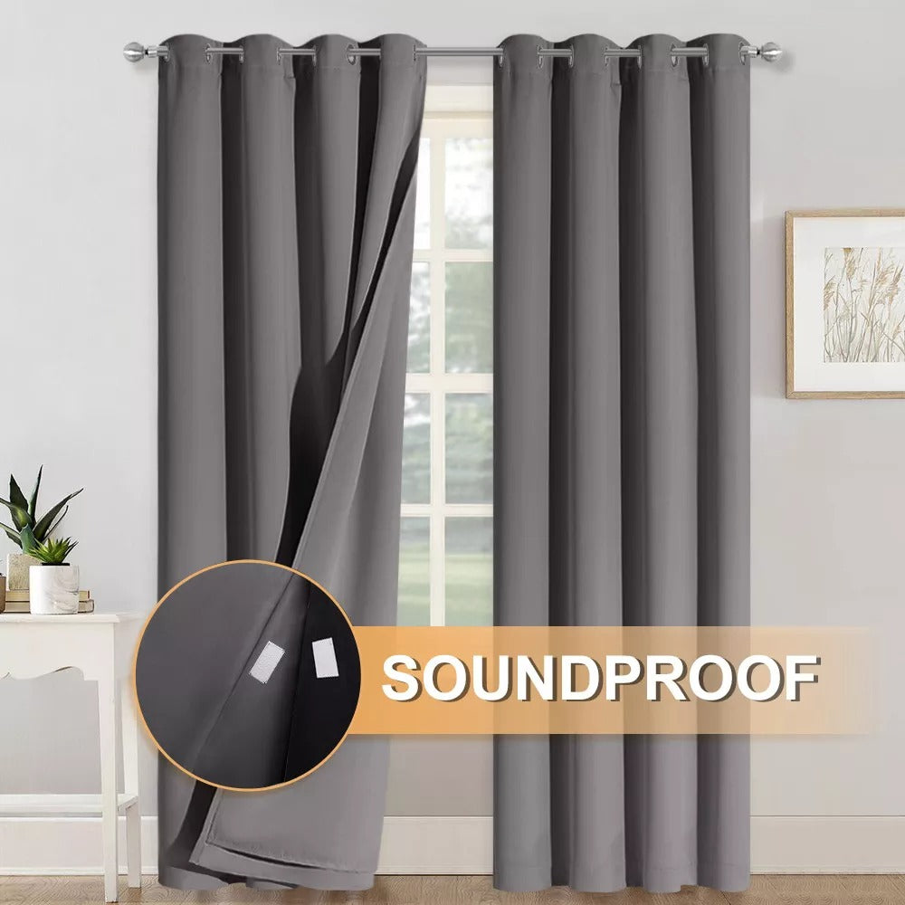 Charcoal 2-panel grommet 3-layer soundproof blackout curtains. One panel open, revealing the layered fabric with soundproofing strips.