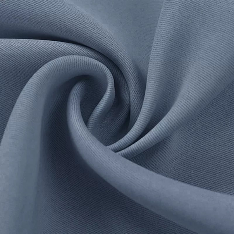 Close-up of the dense, blue-grey fabric for KGORGE 3-layer thermal soundproof blackout curtains, showcasing its soft texture and thickness.