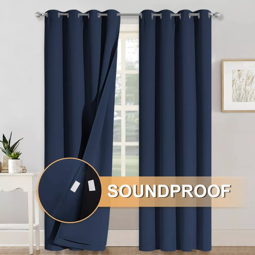 Dark blue grommet curtains, one panel pulled back revealing 3-layer soundproof design with velcro closure for thermal blackout.