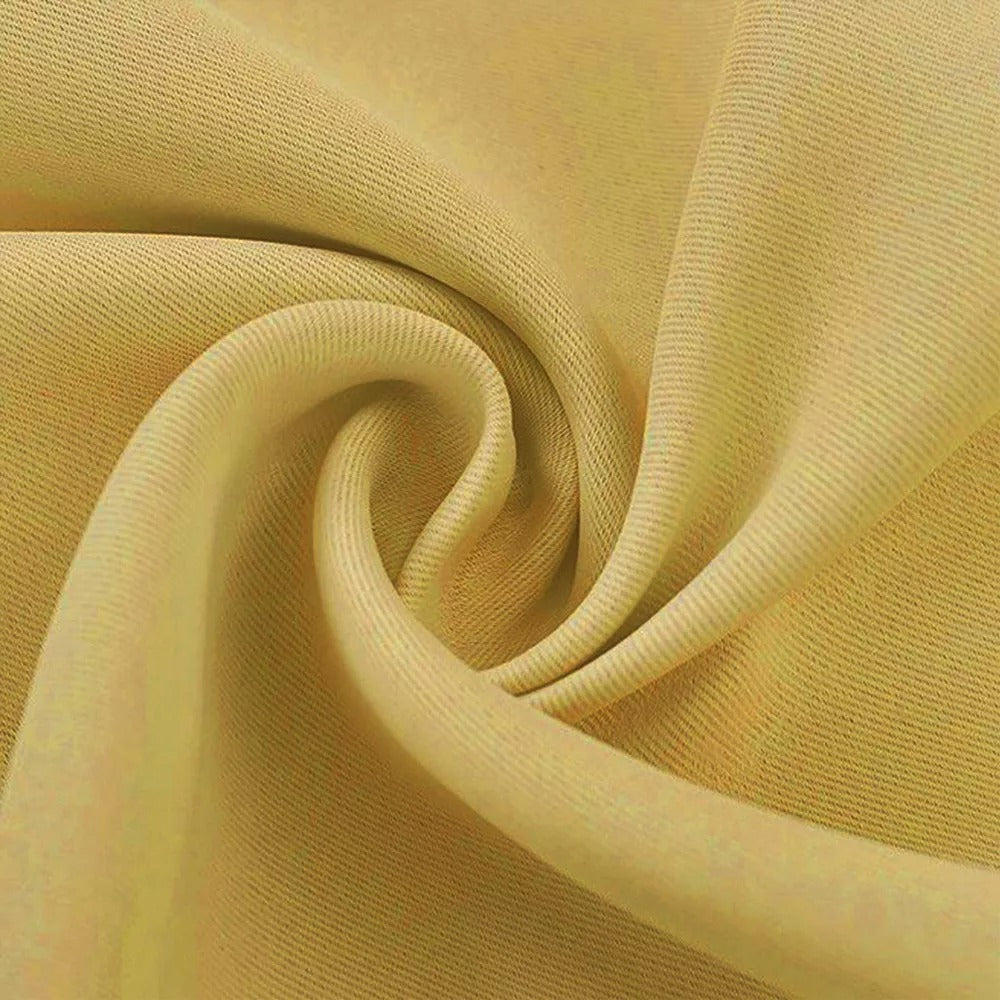 Close-up of the light yellow 3-layer thermal soundproof blackout curtain fabric, highlighting its dense, quality weave for living room or bedroom.