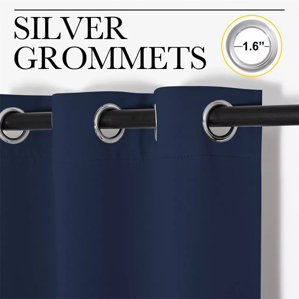 Detail of dark blue 3-layer thermal blackout curtain with 1.6-inch silver grommets for quiet, energy-efficient spaces.