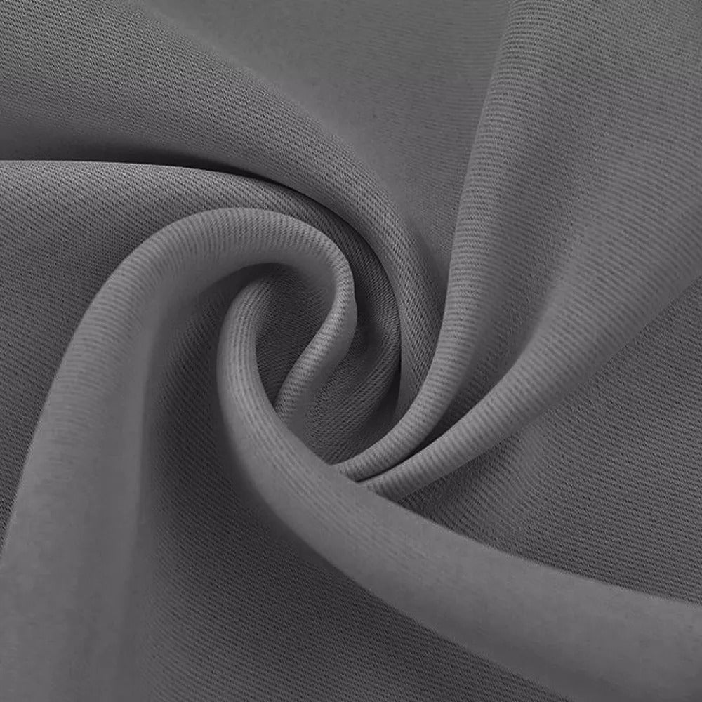 Close-up of textured grey 3-layer fabric, highlighting the dense weave for thermal, soundproof, and blackout curtains.