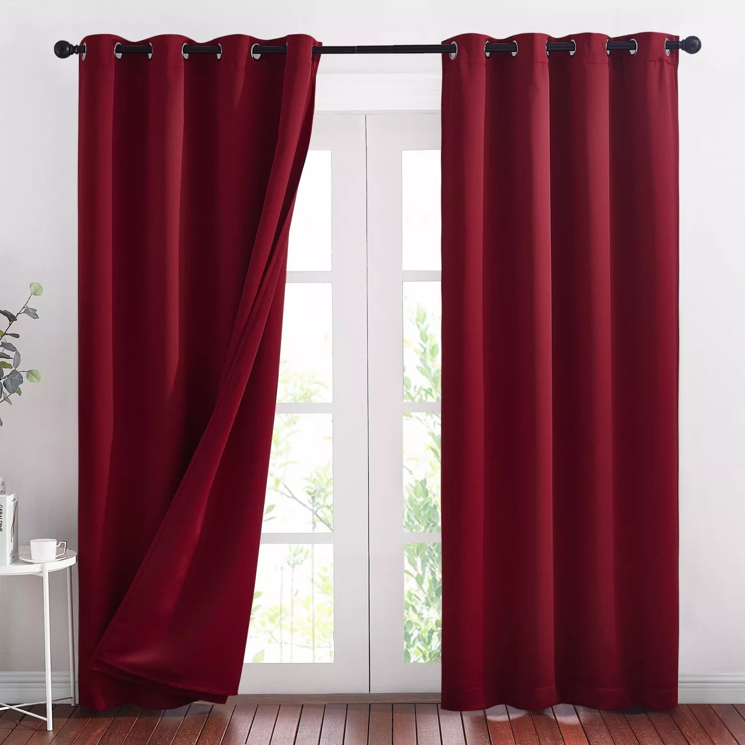 Deep red grommet blackout curtains, 2 panels, one slightly open, showing thick 3-layer thermal soundproof fabric for living room.