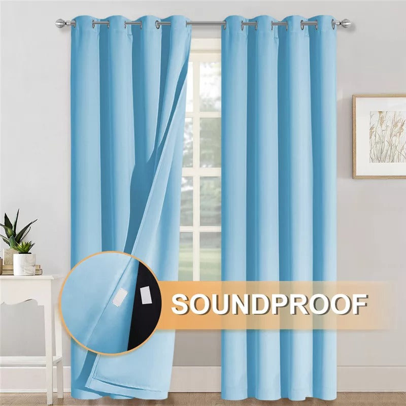 Pastel blue grommet blackout curtains, one panel revealing 3-layer soundproof thermal insulated fabric.