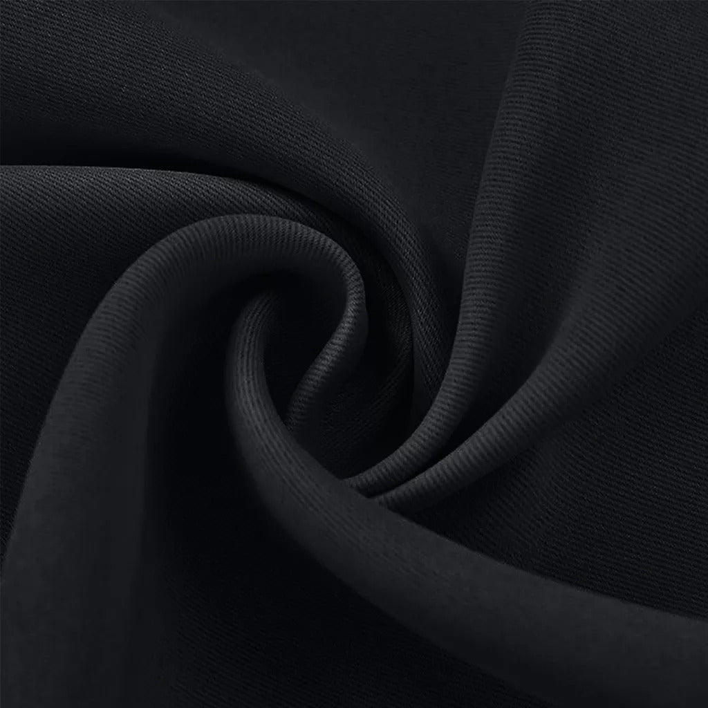 Close-up of black 3-layer thermal soundproof blackout curtain fabric showing its weave and texture.
