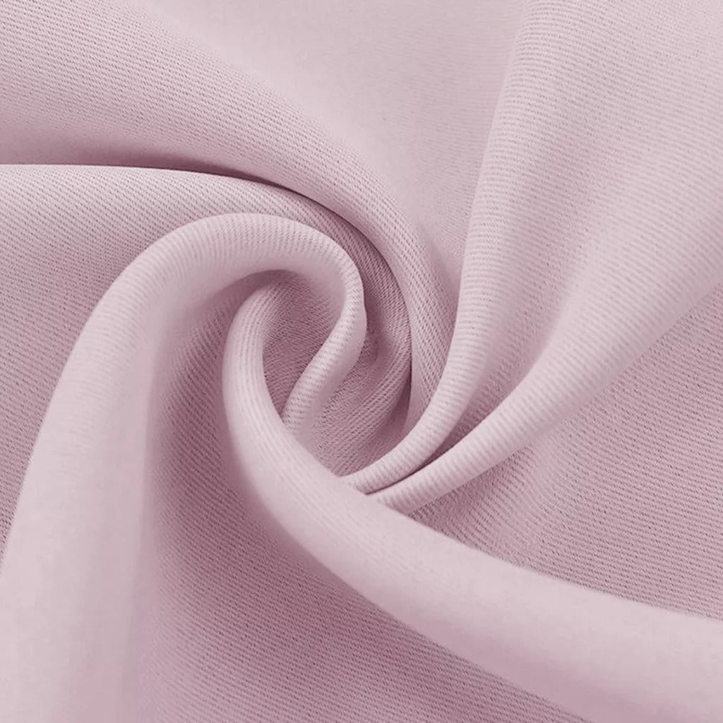 Pink 3-layer thermal soundproof blackout curtain fabric close-up, highlighting texture and elegant drape.