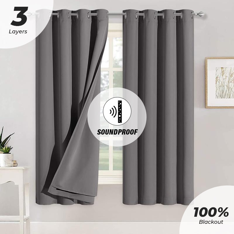 Dark gray 3-layer thermal insulated soundproof 100% blackout grommet curtains. One panel slightly open for bedroom or living room.