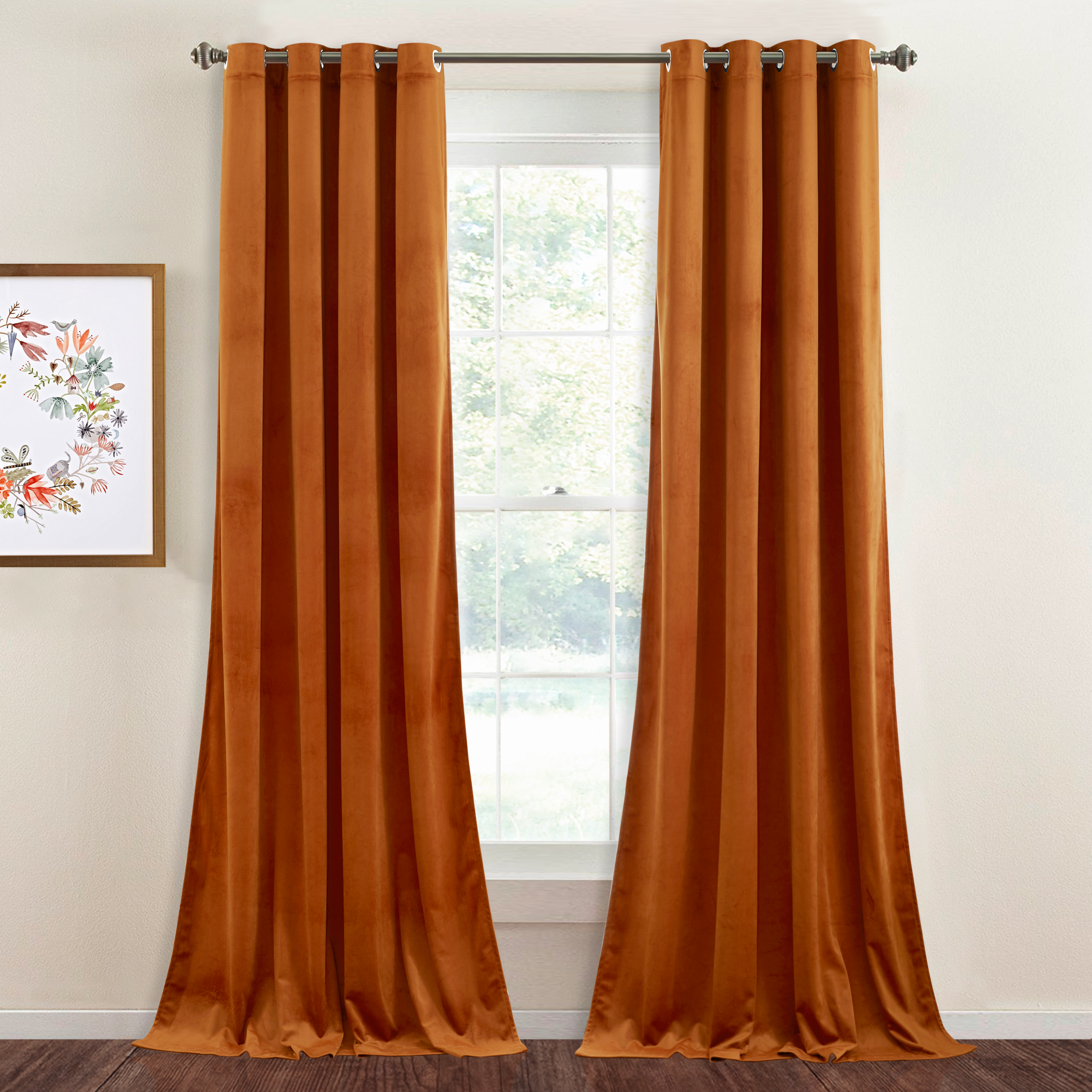 Two rust orange velvet blackout curtains with silver grommet tops, partially open on a window in a stylish living room.