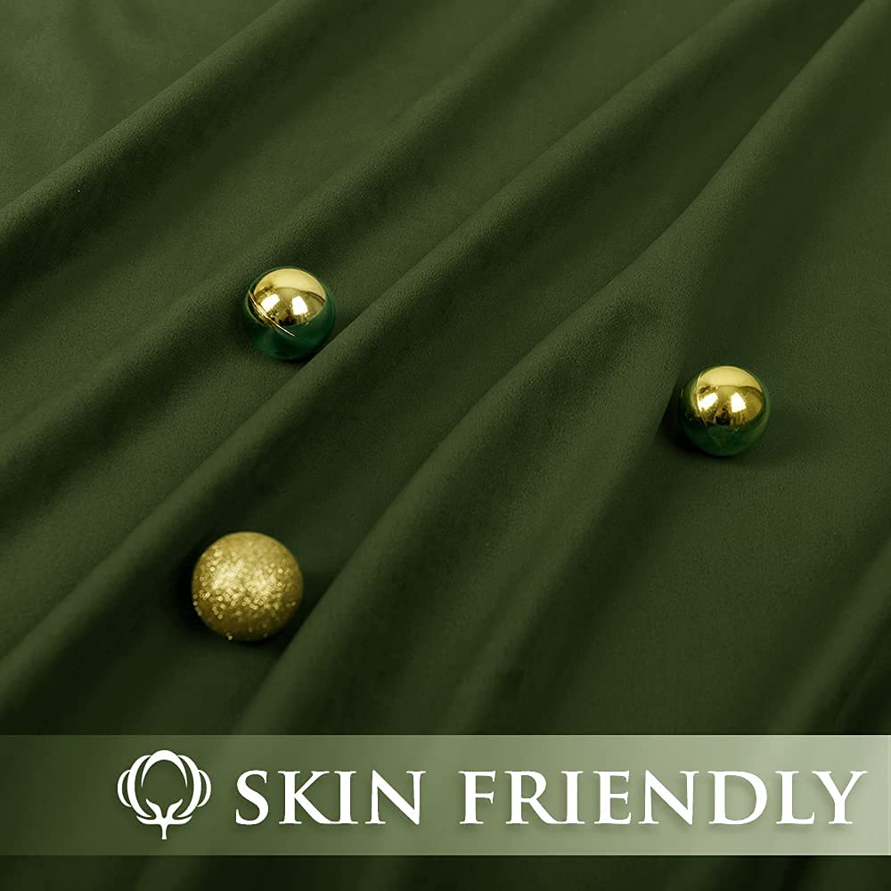 Close-up of soft deep green velvet blackout curtain fabric, showcasing its luxurious texture and elegant drapes, with 'SKIN FRIENDLY' text.