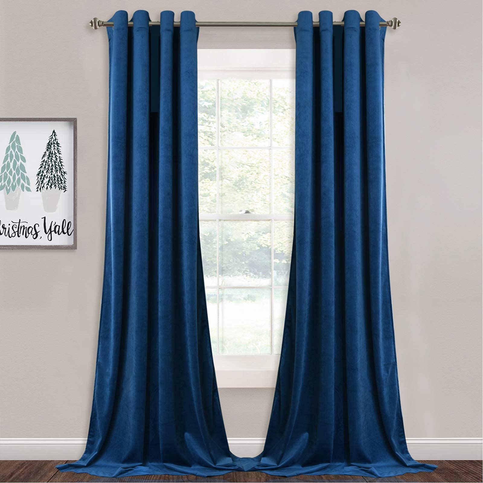 Two dark blue velvet grommet blackout curtains, slightly open, framing a bright window. Ideal for bedroom & living room privacy.