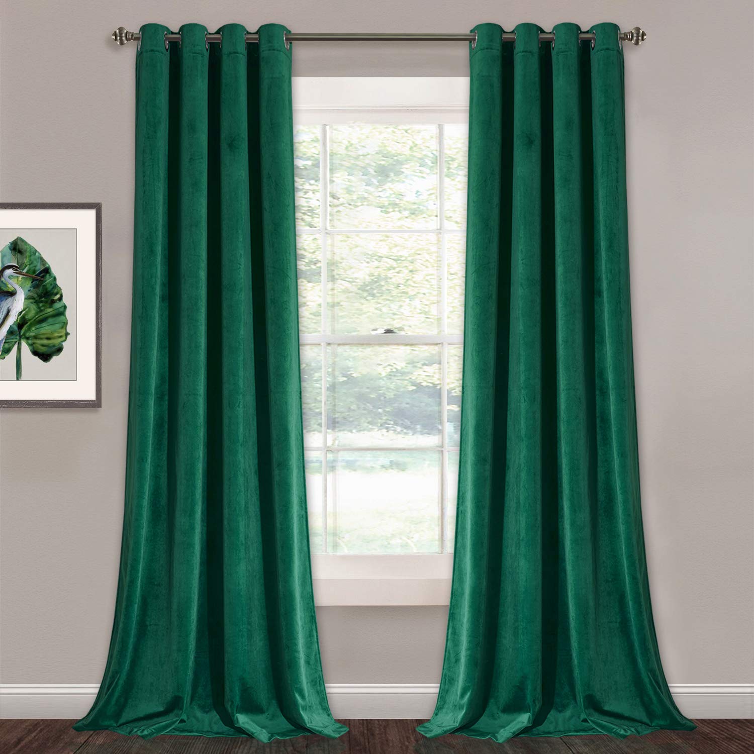 Two emerald green velvet grommet blackout curtains for bedroom or living room, enhancing privacy & light control.