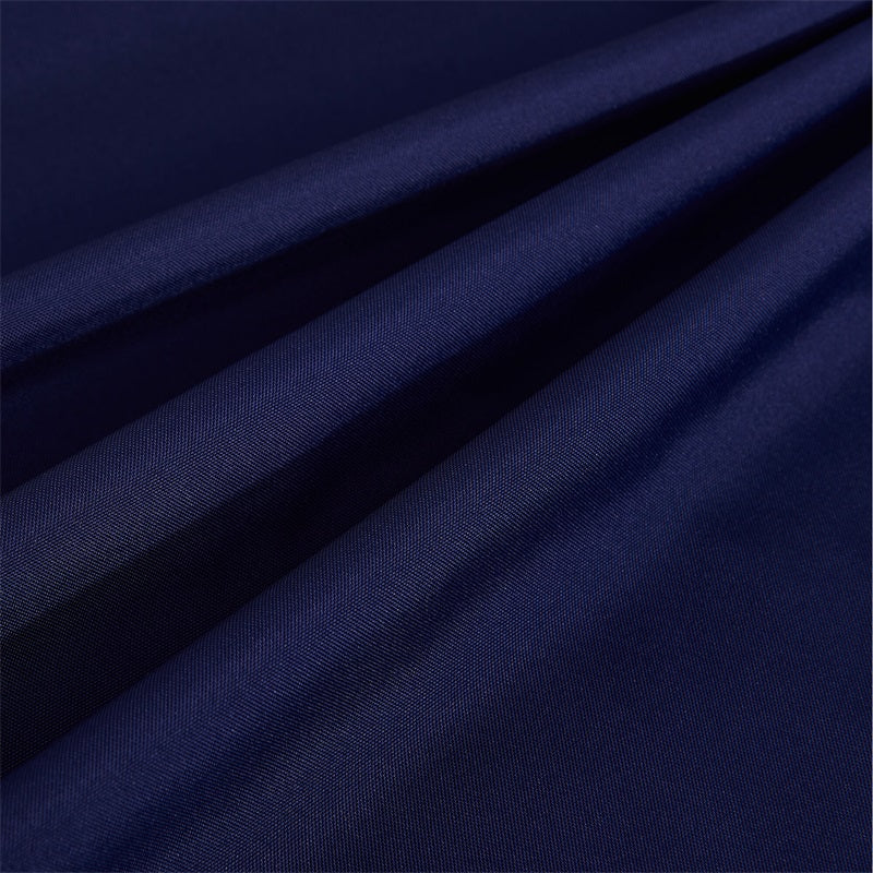 Close-up of rich navy blue waterproof outdoor canvas curtain fabric, showing durable texture & windproof material.