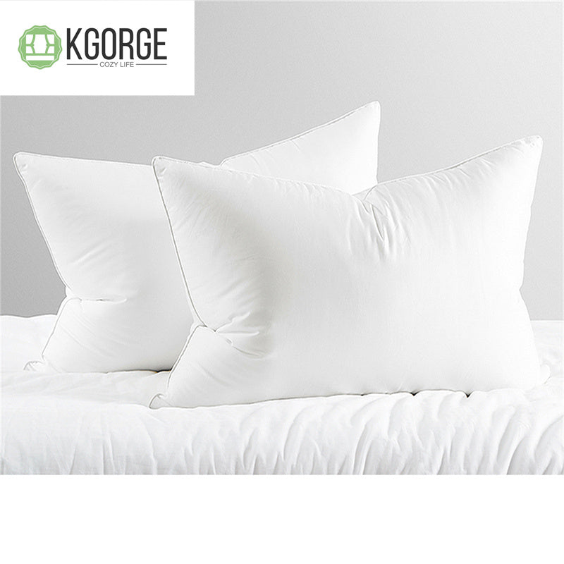 Two plush white pillows from KGORGE COZY LIFE collection on a bed, perfect for a comfortable bedroom setup.