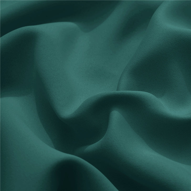 Close-up of deep teal KGORGE outdoor curtain fabric sample, showing weatherproof, fade-resistant texture & soft folds.