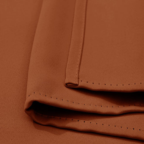 Close-up of terracotta KGORGE outdoor standard curtain fabric sample, highlighting durable stitching and weatherproof texture.