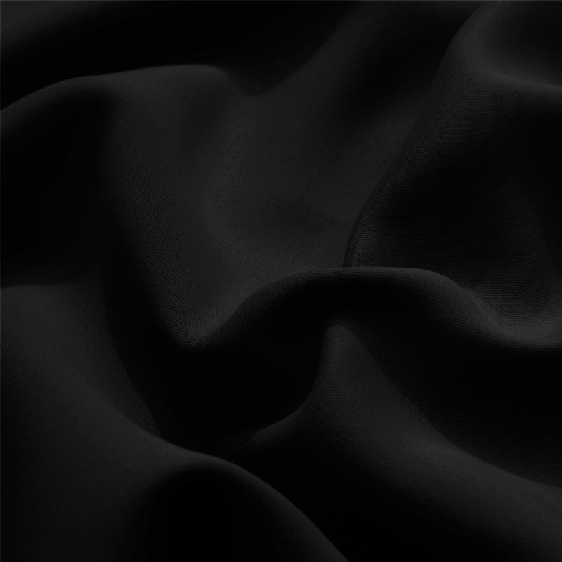 Close-up of a black KGORGE outdoor curtain fabric sample, showcasing the durable, weatherproof material's texture and drape for standard shade solutions.
