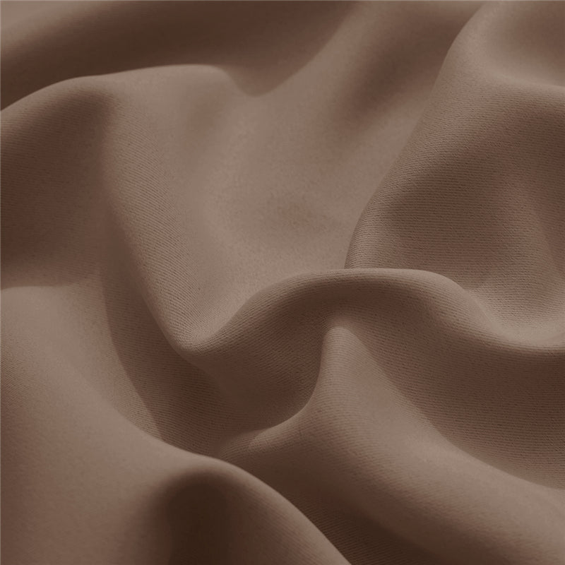 Close-up of a medium brown KGORGE outdoor curtain fabric sample. Features its dense weave, subtle texture, and quality drape.