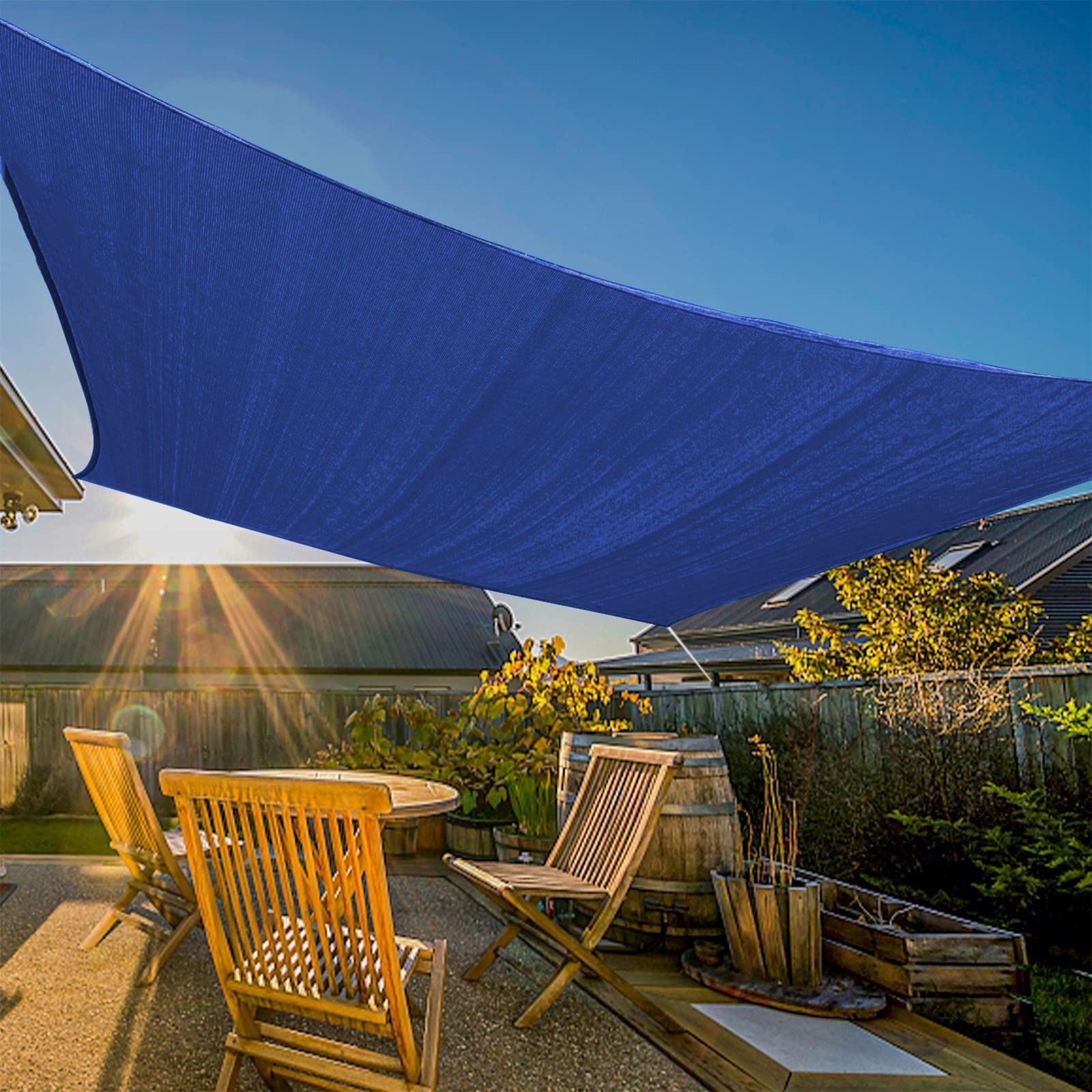 Large blue heavy-duty waterproof sun shade sail awning canopy over a patio with wooden furniture, ideal for garden shade.