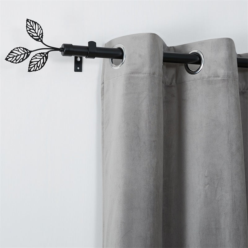 Black adjustable Leaf Metallo outdoor curtain rod with decorative leaf finials and a grey weatherproof outdoor curtain.