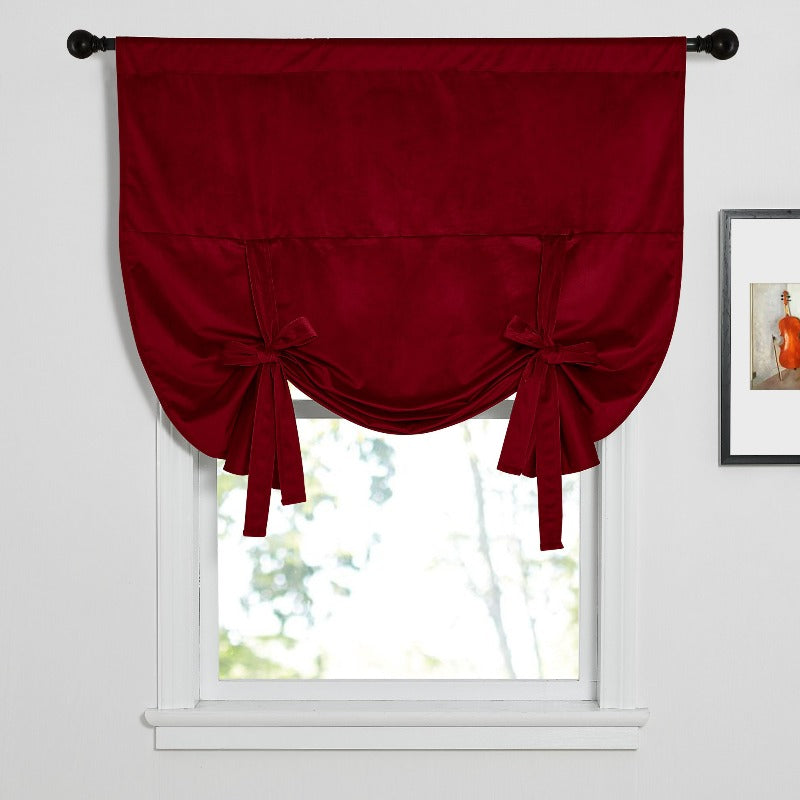 Modern burgundy rod pocket tie-up blackout velvet valance on a window, perfect for kitchen or living room decor.