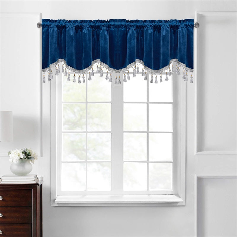 Luxurious navy blue velvet blackout valance with rod pocket and decorative silver tassels for a modern living room.