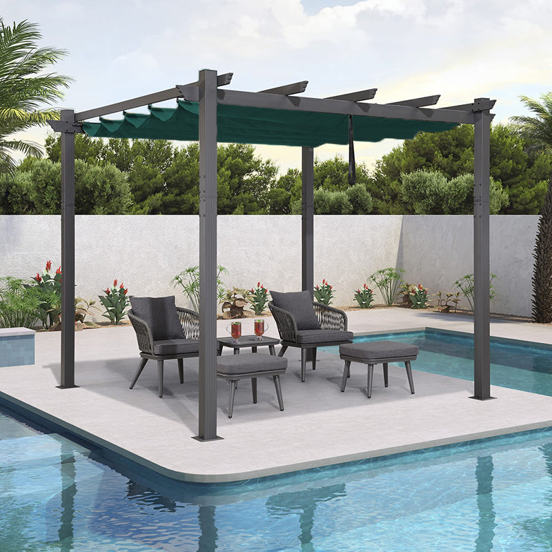 Dark gray pergola featuring a retractable dark green canopy fabric, providing shade for a patio lounging area by a pool.