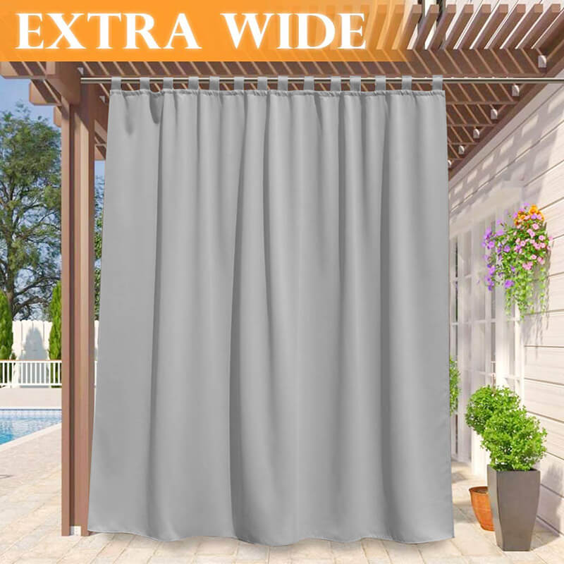 Extra wide grey tab top waterproof outdoor curtain panel for a porch or deck, enhancing privacy and shade for a poolside patio.