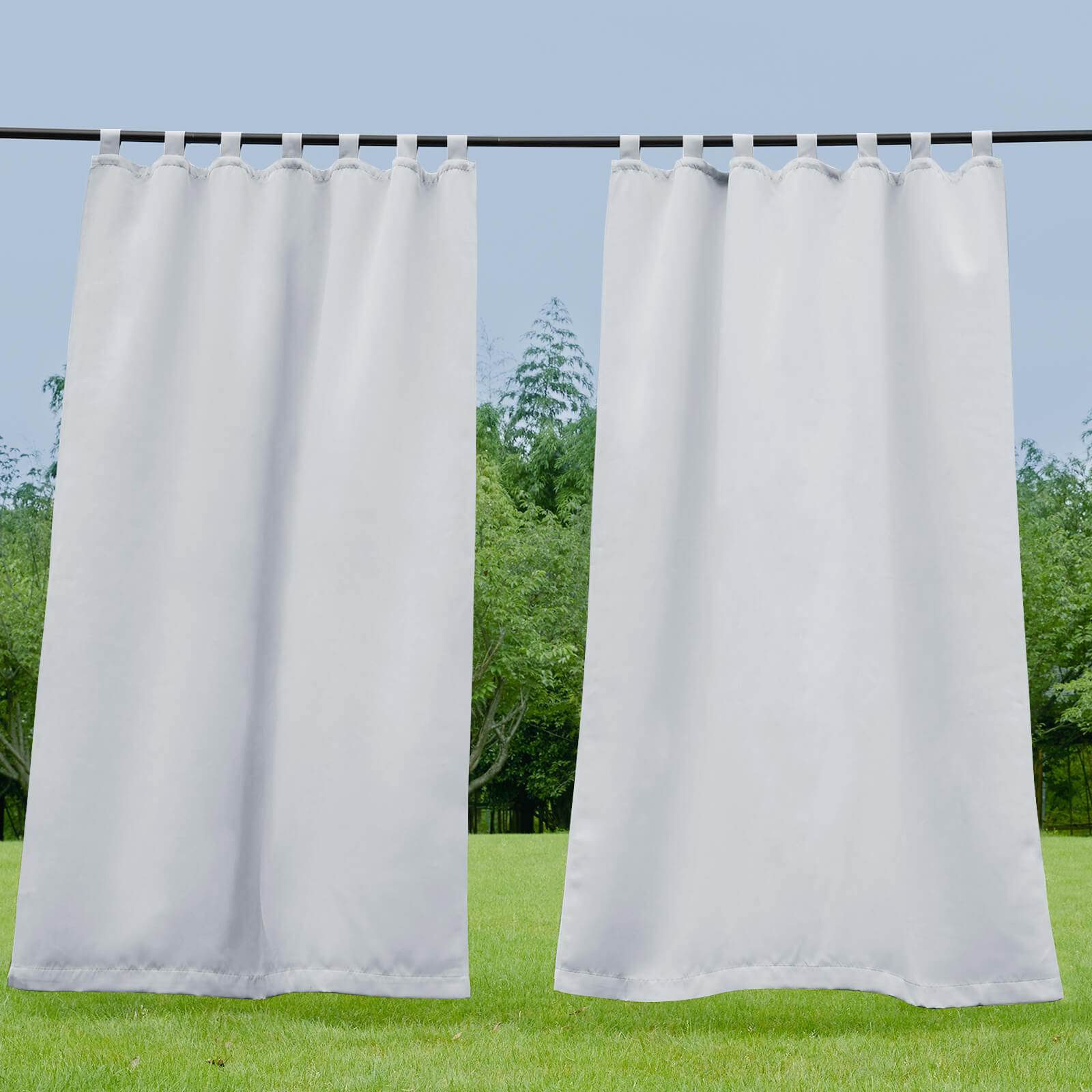 Light grey waterproof tab top outdoor curtains providing privacy & weather protection for porch, deck, or patio.