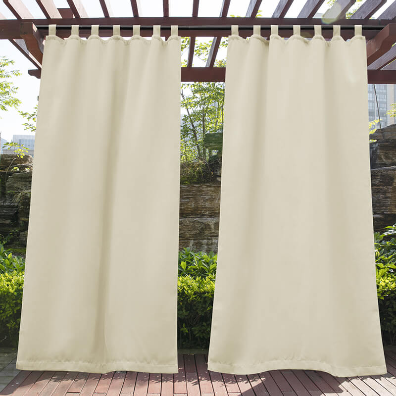 Two light beige waterproof tab top outdoor curtains on a pergola, offering privacy for porch deck & patio living spaces.