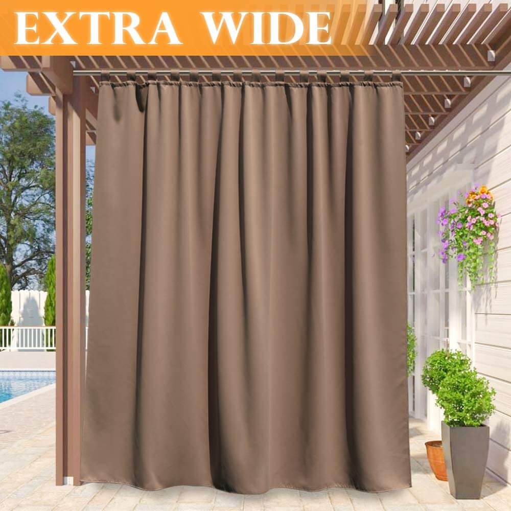 Brown extra wide waterproof tab top outdoor curtain panel on a pergola, providing porch deck privacy.