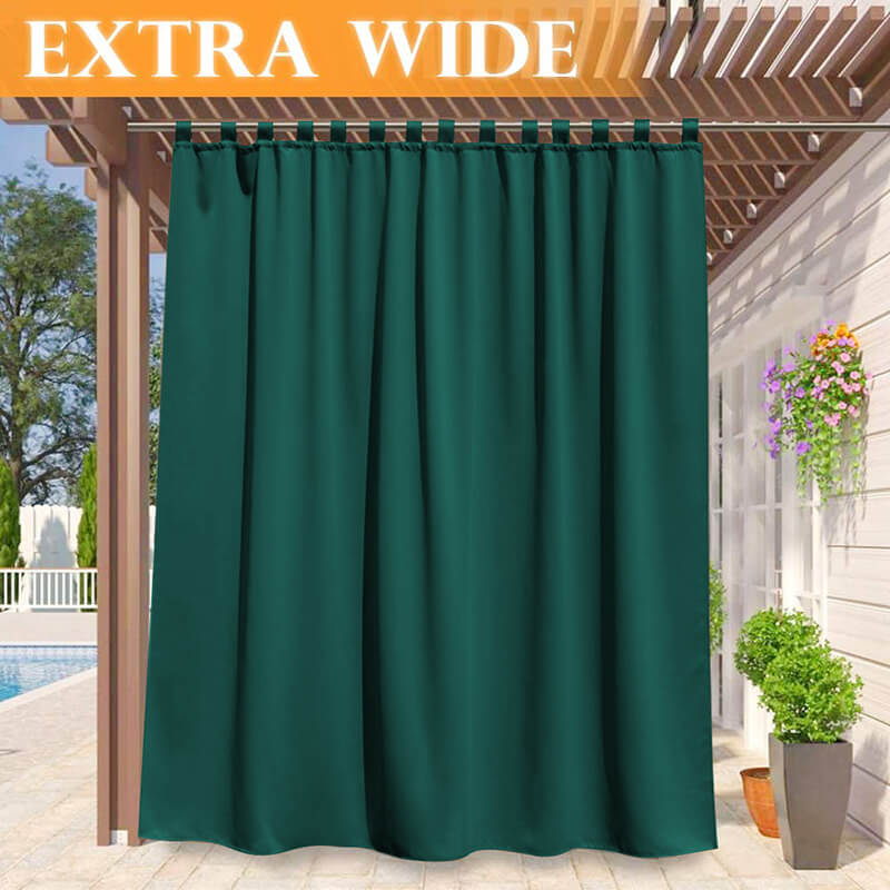 Extra wide dark green waterproof tab top outdoor curtain panel on a pergola, shading a patio deck with a pool.